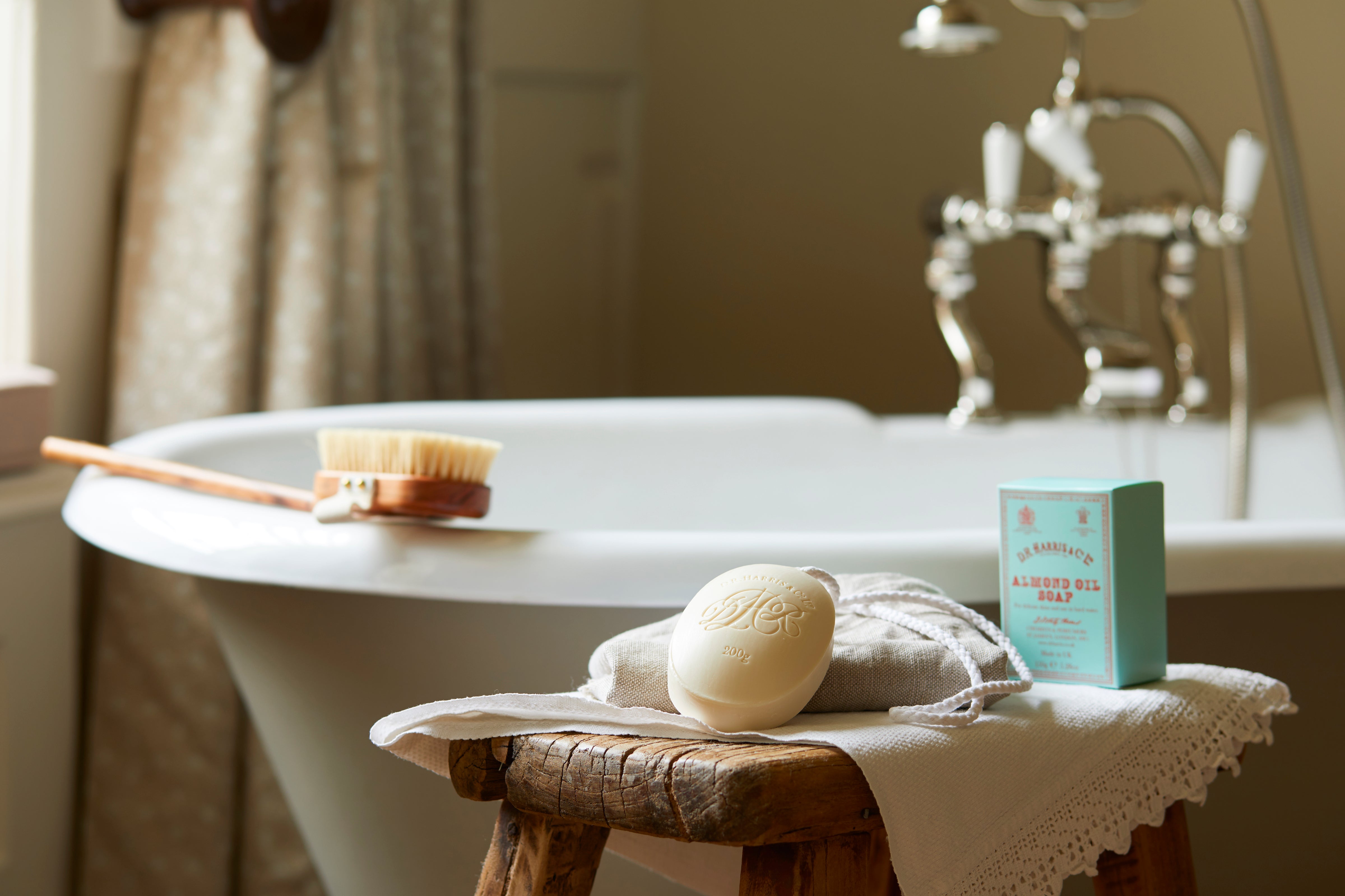 d.r. harris soap on a roap displayed next to a bathtub
