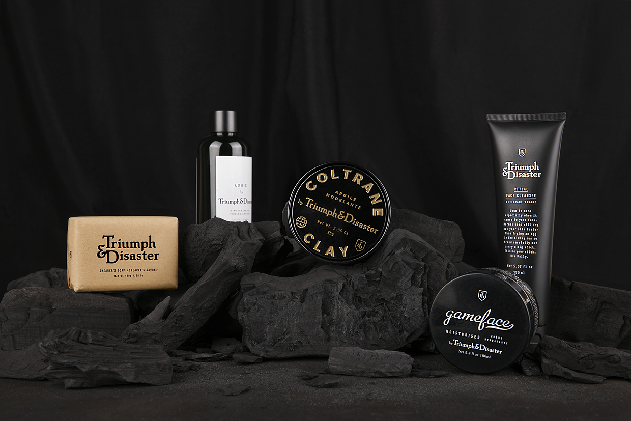 assortment of products from triumph & disaster on a black display
