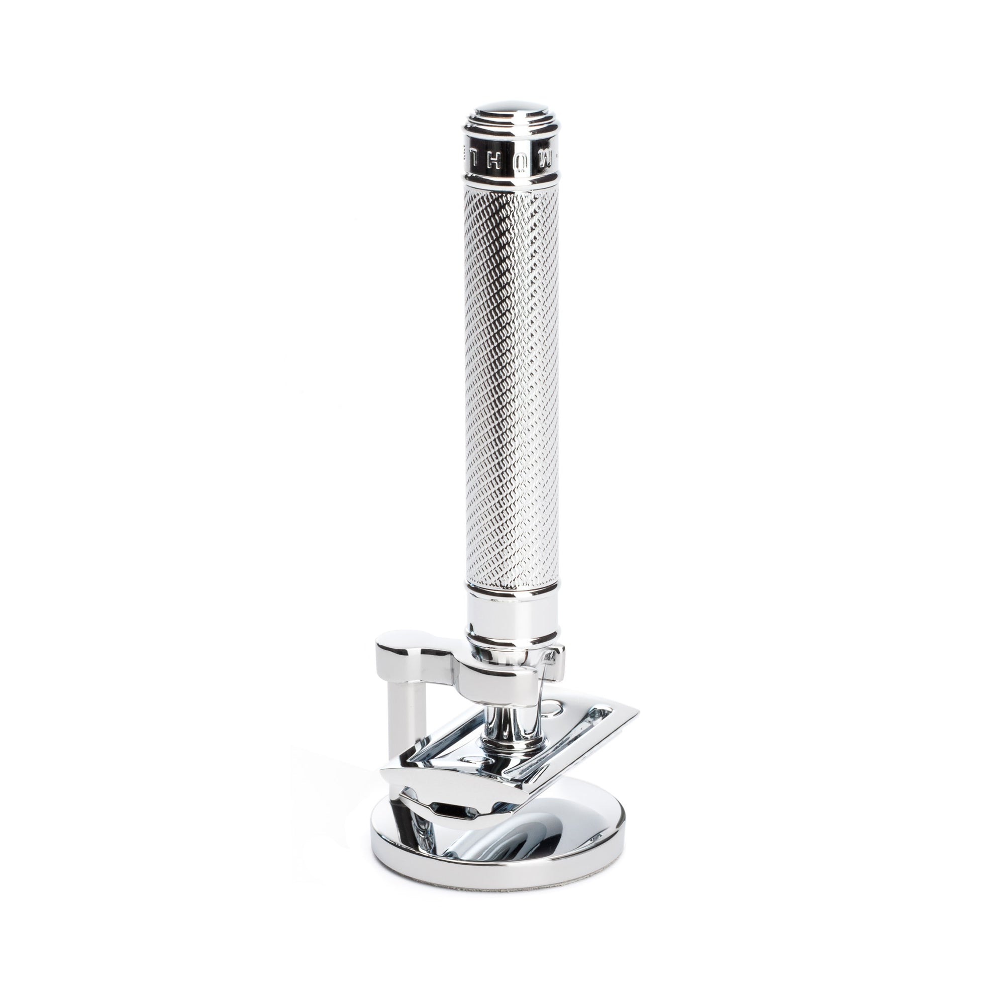 Chrome safety razor on a white background