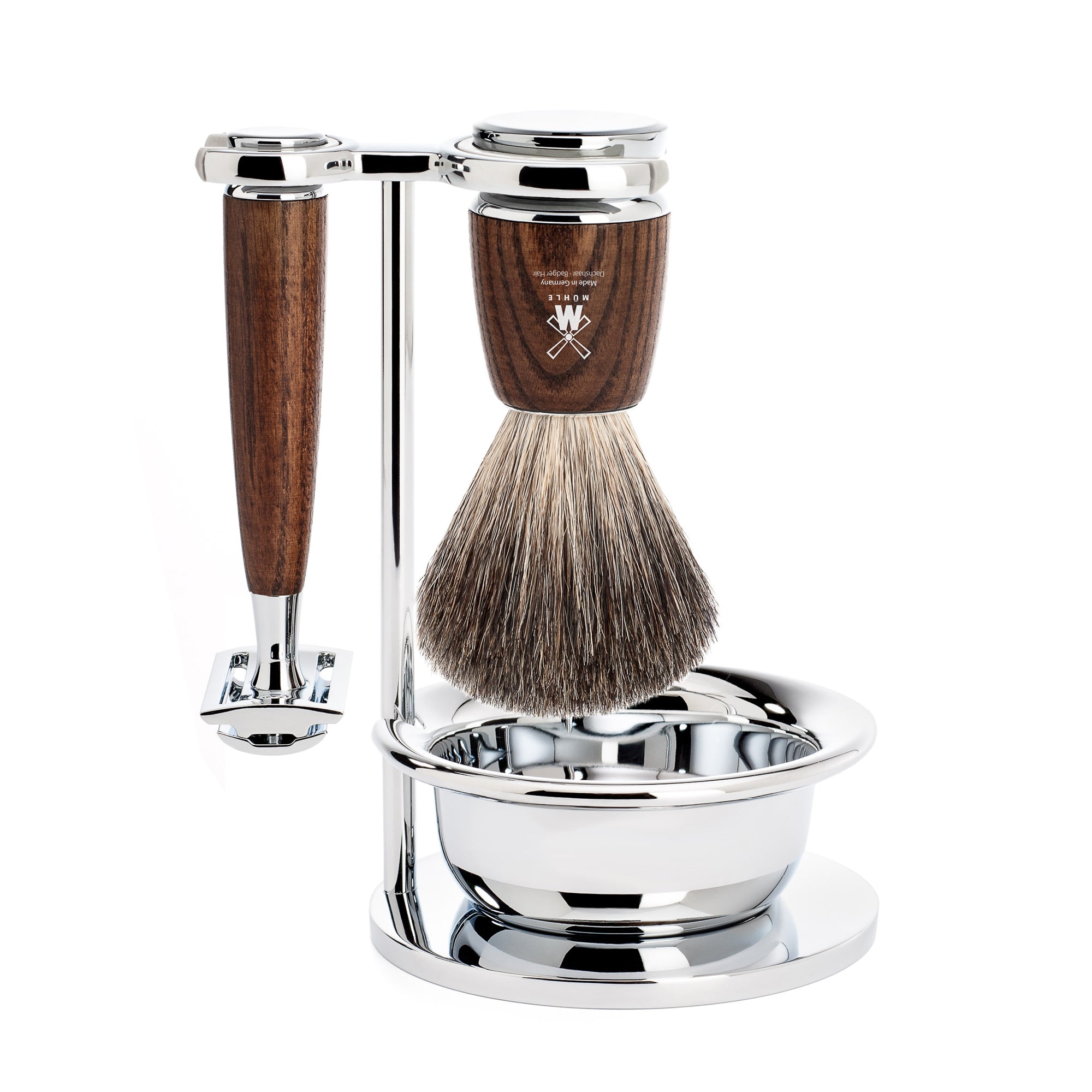 Shaving brush and razor with wooden handle and silver stand on a white background
